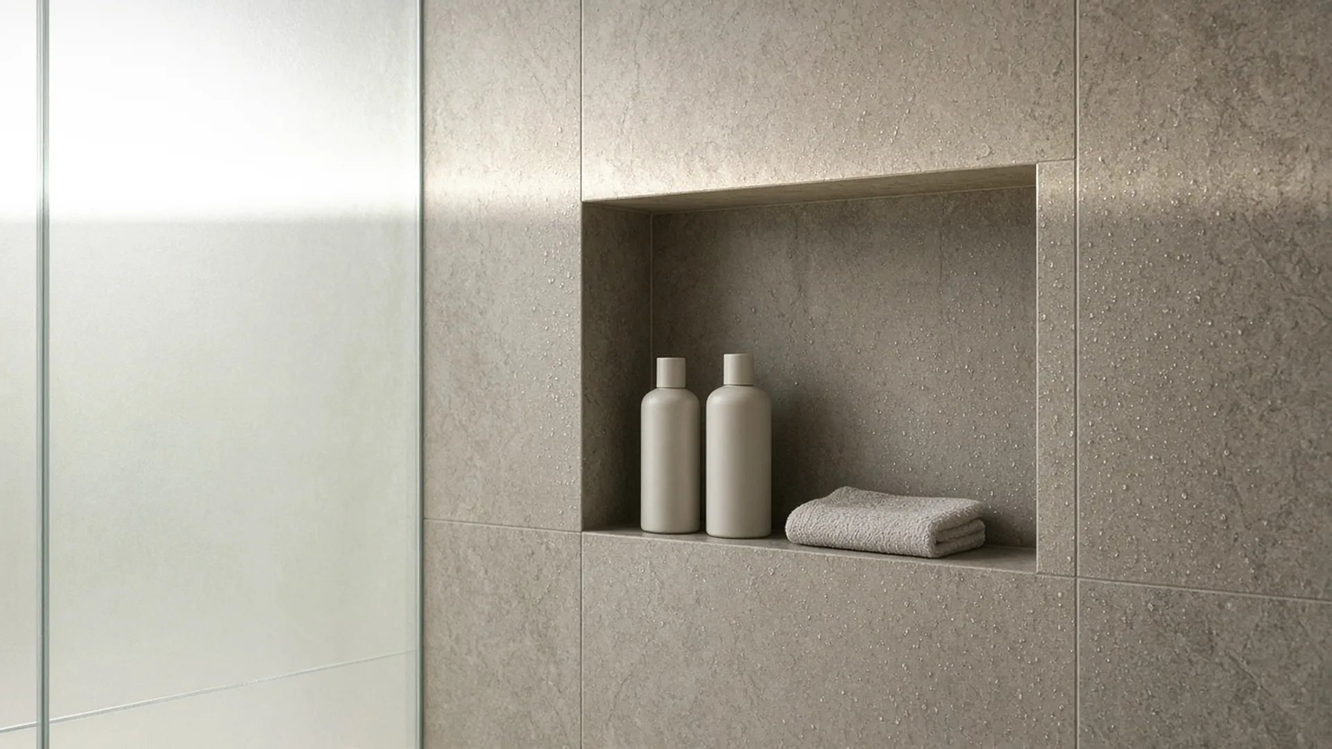 Two plain bottles in a stone shower niche